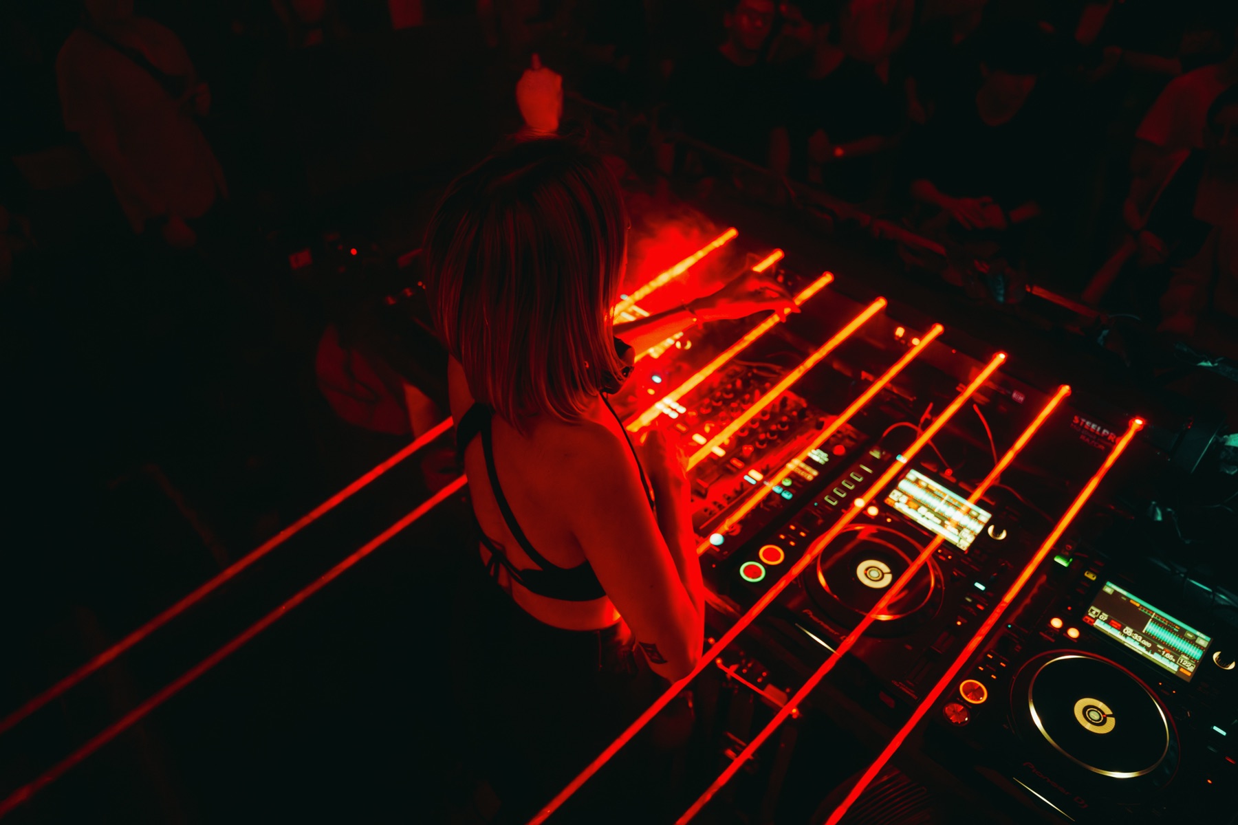 DJ booth under laser lights